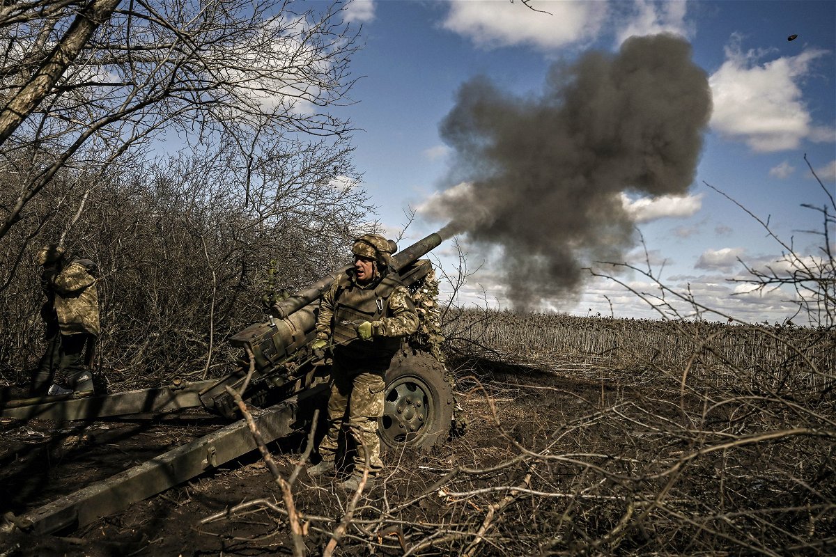 <i>Aris messinis/AFP/Getty Images</i><br/>Ukrainian servicemen fire at Russian positions with a 105mm howitzer in the region of Donbas