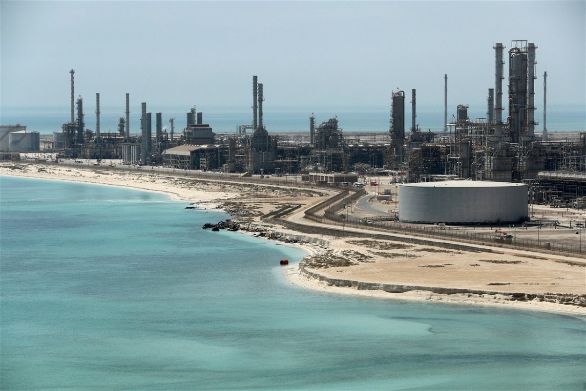 <i>Ahmed Jadallah/Reuters</i><br/>Oil prices surged Monday after OPEC+ producers unexpectedly announced that they would cut output. Pictured is Ras Tanura oil refinery in Saudi Arabia