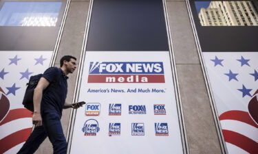 A person walks past the Fox News Headquarters in New York