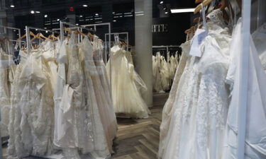 Wedding dresses are displayed in a window at a David's Bridal store in Manhattan on November 19