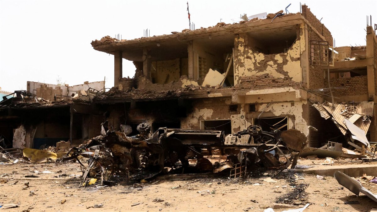 <i>Mohamed Nureldin Abdallah/Reuters</i><br/>A damaged car and buildings at the central market during clashes between the paramilitary Rapid Support Forces and the army in Khartoum North