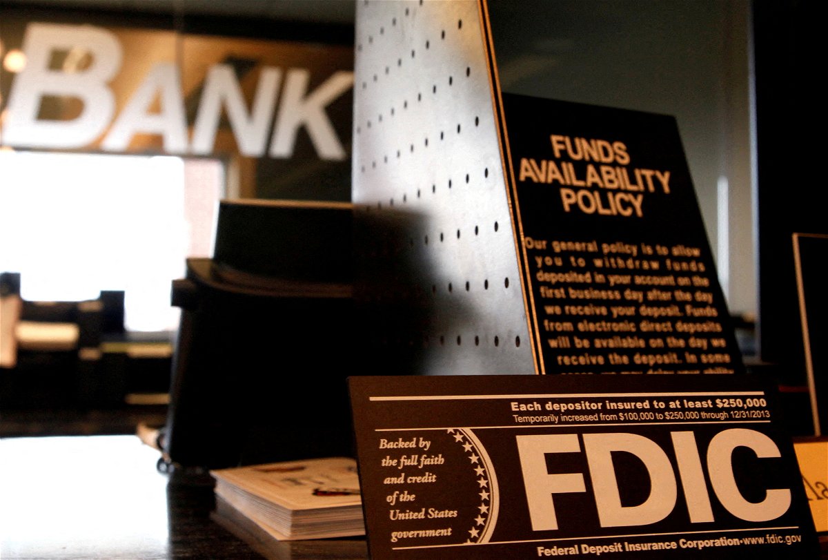<i>Rick Wilking/Reuters</i><br/>Signs explaining the FDIC and banking policies on the counter of a bank in Colorado.