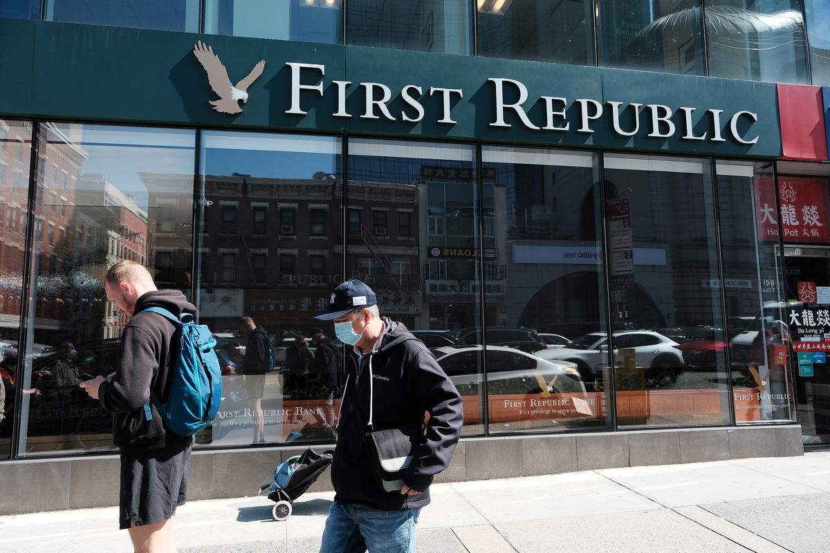 <i>Spencer Platt/Getty Images</i><br/>A person walks past a First Republic bank branch in Manhattan on April 24 in New York City.