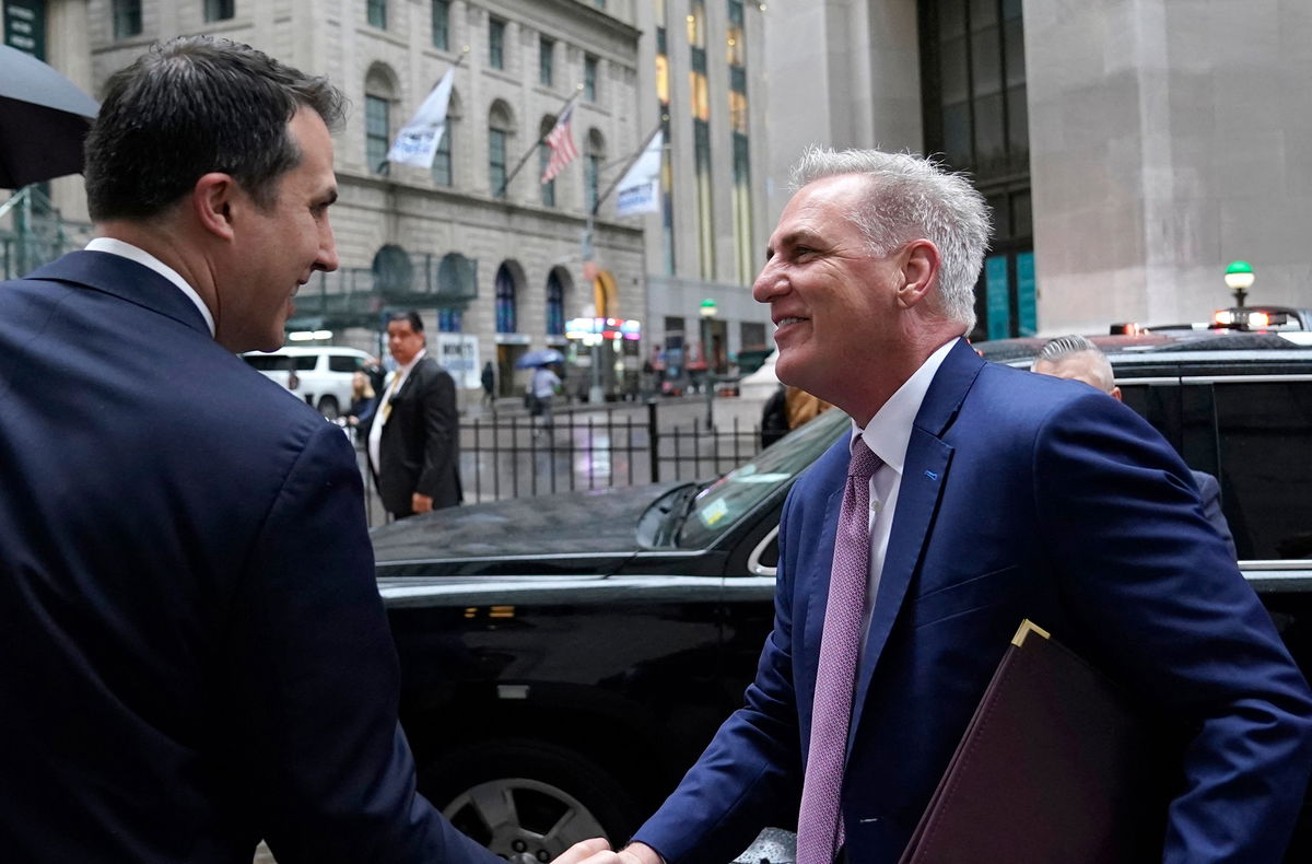 <i>Timothy A. Clary/AFP/Getty Images</i><br/>US House Speaker Kevin McCarthy is greeted by John Tuttle