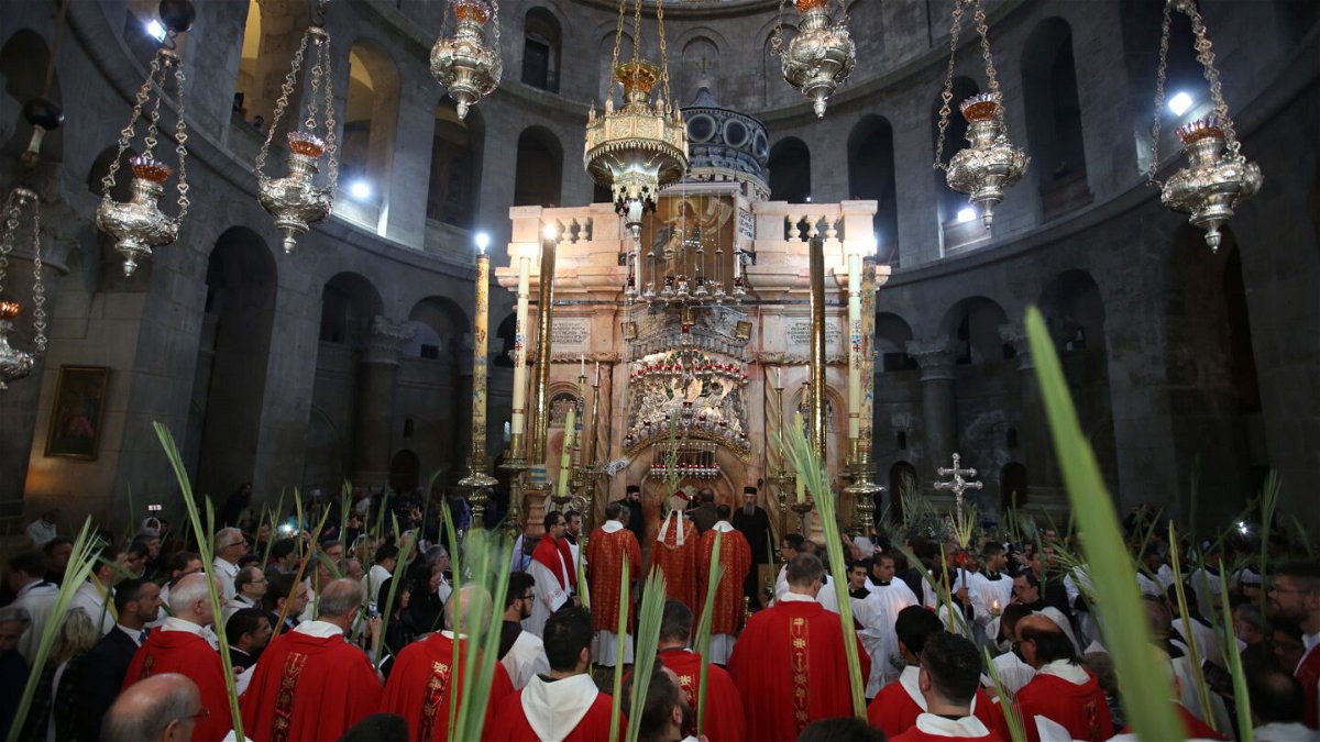 <i>GALI TIBBON/AFP/Getty Images</i><br/>Palm Sunday during the pandemic will be different than this 2017 procession at the Church of the Holy Sepulchre in Jerusalem's Old City.