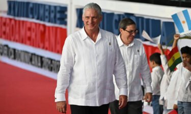 Cuban President Miguel Diaz-Canel (L) term has been marked by a succession of calamities that pushed Cuba even nearer to the brink of economic collapse.