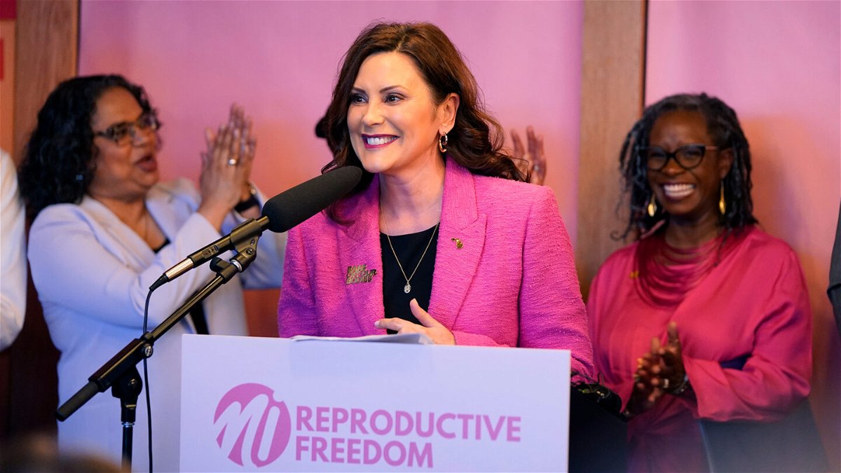 <i>Carlos Osorio/AP</i><br/>Michigan Gov. Gretchen Whitmer addresses supporters before signing legislation to repeal the 1931 abortion ban on April 5 in Birmingham.