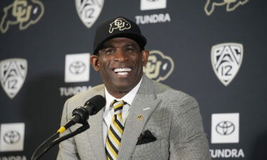 Deion Sanders speaks after being introduced as the new head football coach at the University of Colorado in December.