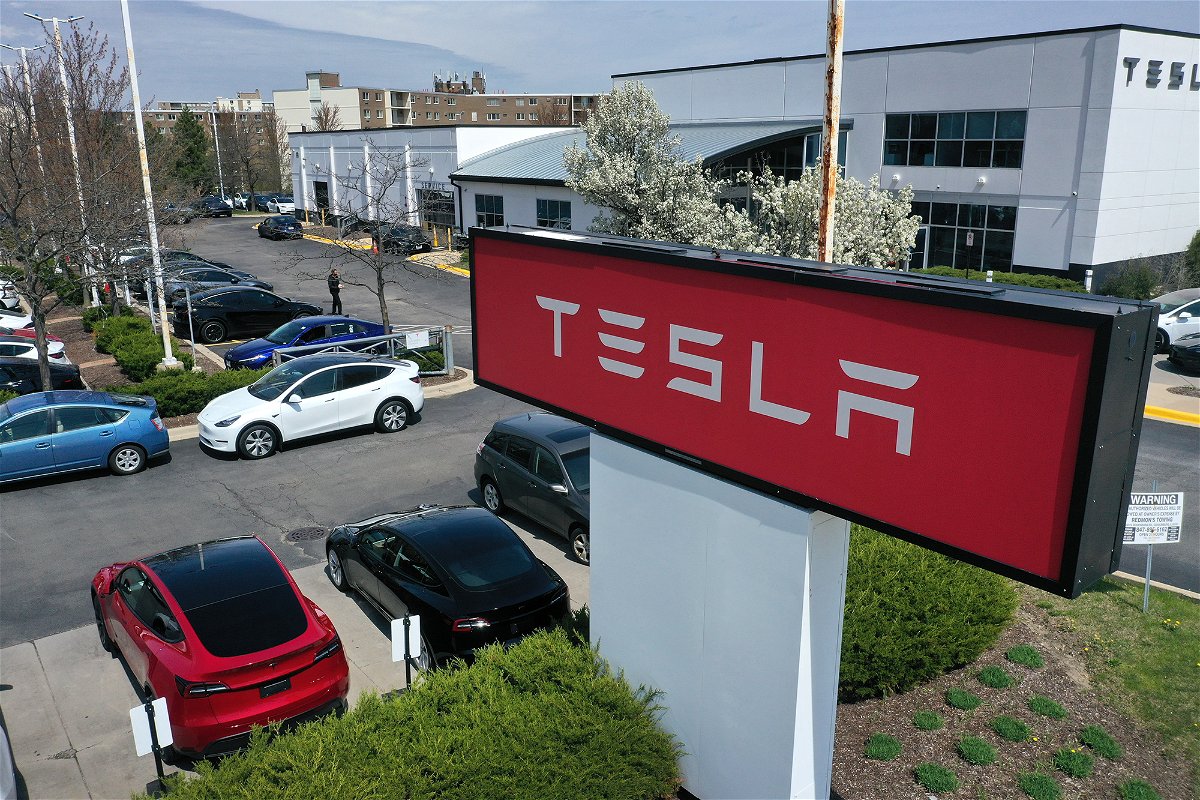 <i>Scott Olson/Getty Images</i><br/>A sign marks the location of a Tesla dealership on April 19 in Schaumburg