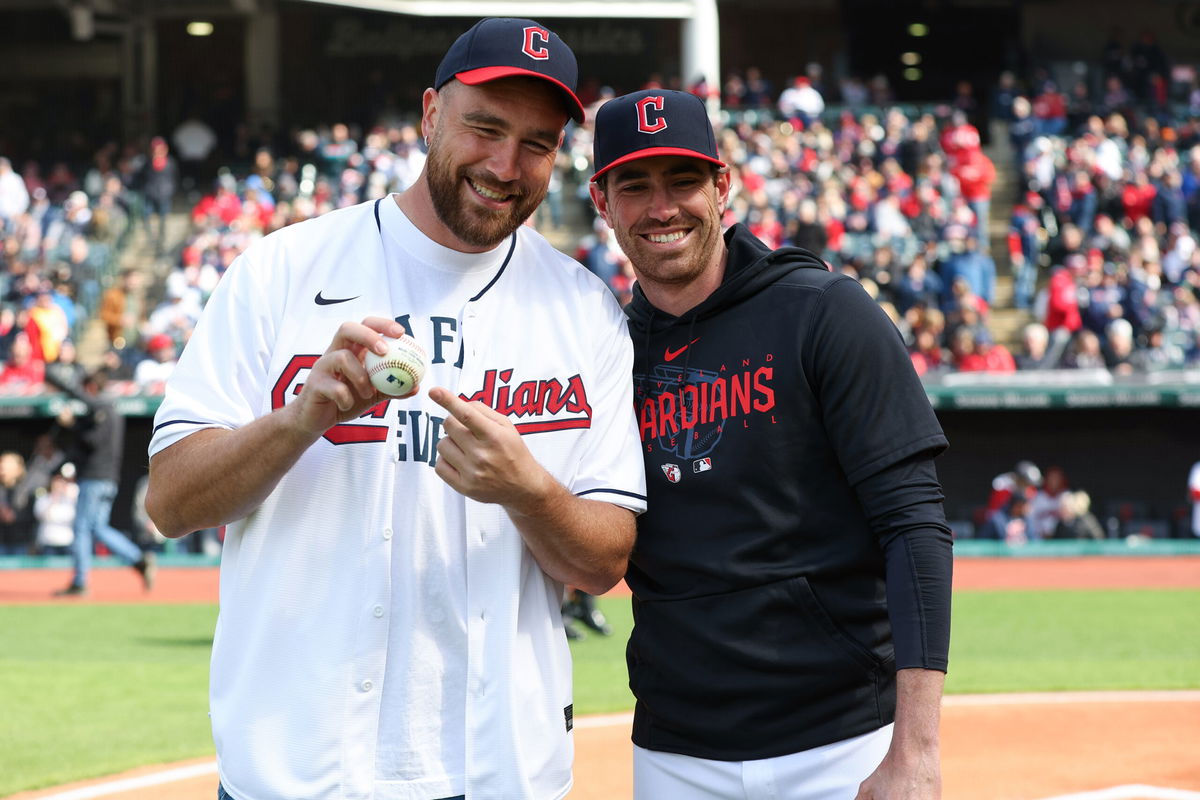 <i>Lauren Bacho/MLB/Getty Images</i><br/>Shane Bieber (right) was poised to catch Kelce's pitch but leapt out of the way to avoid the ball hitting him.