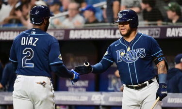 Yandy Diaz and Harold Ramírez celebrate in the third inning against the Houston Astros.