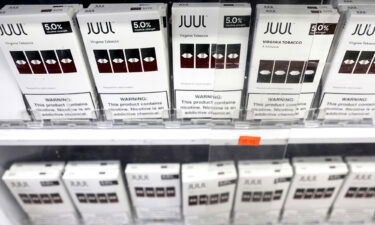 Juul Labs is paying $462 million to six US states and DC in the largest multi-state settlement yet for the troubled company. Juul e-cigarettes are displayed here for sale in 2022 in Los Angeles.