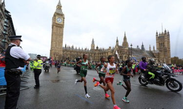 Hassan (center left) passes Big Ben on her way to an unexpected victory in London.