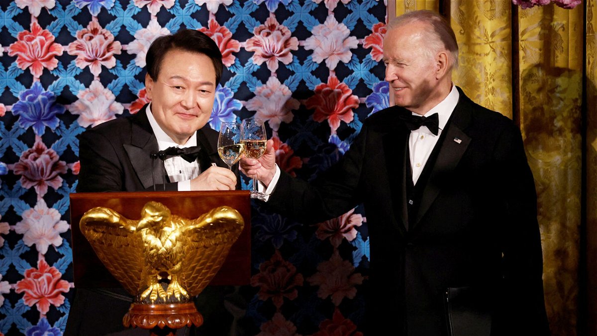 <i>Evelyn Hockstein/Reuters</i><br/>President Joe Biden and South Korea's President Yoon Suk Yeol exchange toasts during an official State Dinner in Washington