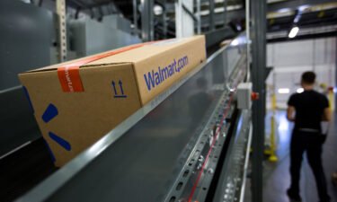 A package moves along a conveyor belt inside a Wal-Mart Stores Inc. fulfillment center in Bethlehem
