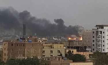 Smoke rises from the tarmac of Khartoum International Airport as a fire burns