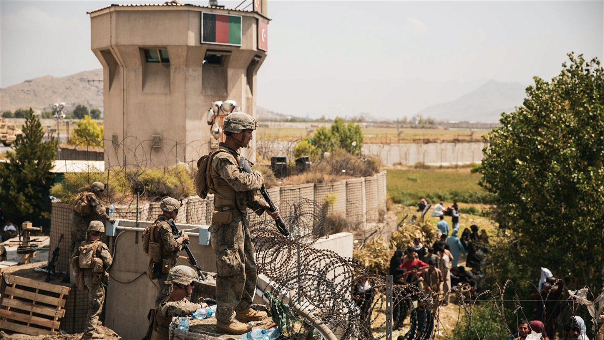 <i>Staff Sgt. Victor Mancilla/US Marines/US Central Command Public Affairs</i><br/>US Marines assist with security at an evacuation control checkpoint during an evacuation at Hamid Karzai International Airport in Kabul