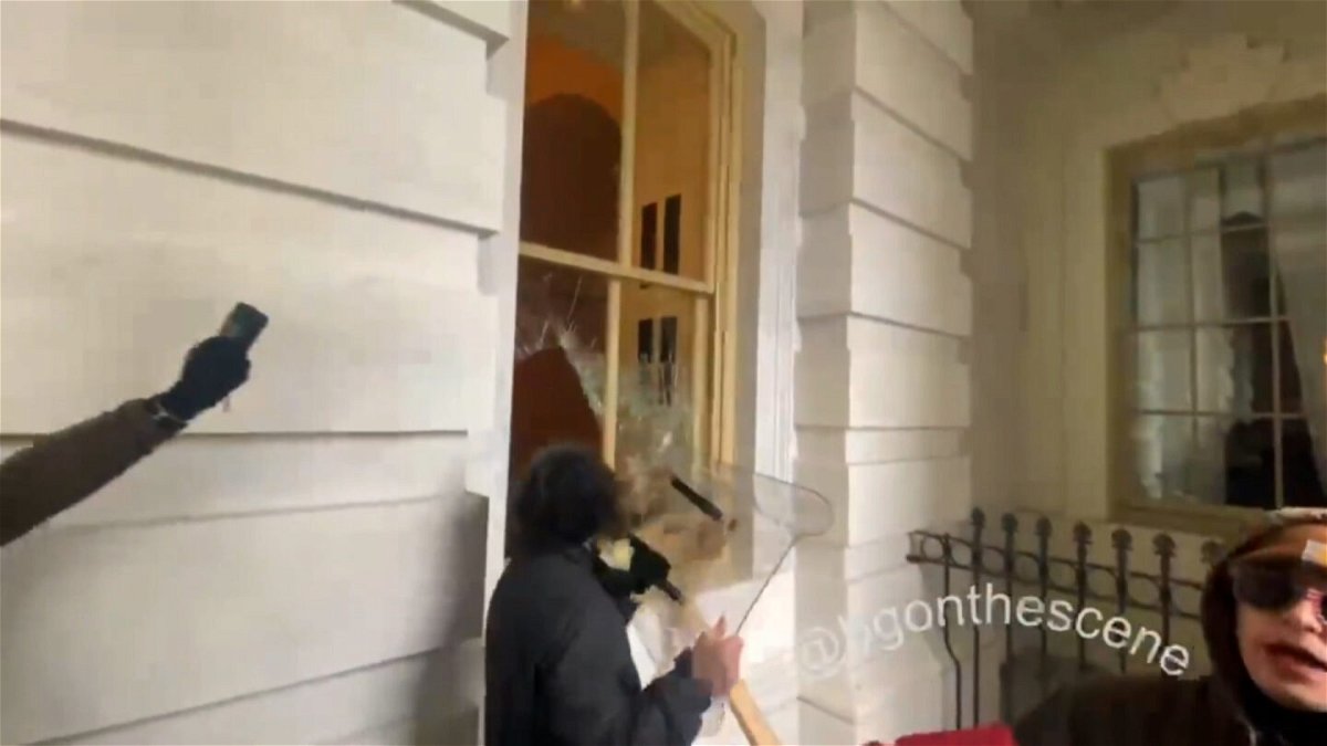<i>courtesy FROM BRENDAN GUTENSCHWAGER</i><br/>Dominic Pezzola smashes a window with a police riot shield.