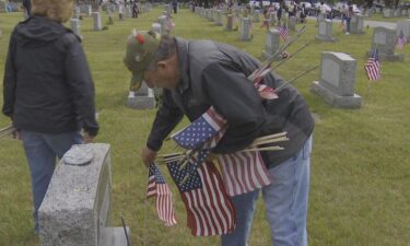 Veteran Roland Pelletier spent the day placing flags at Elmwood Cemetery. "My dad was a World War II vet