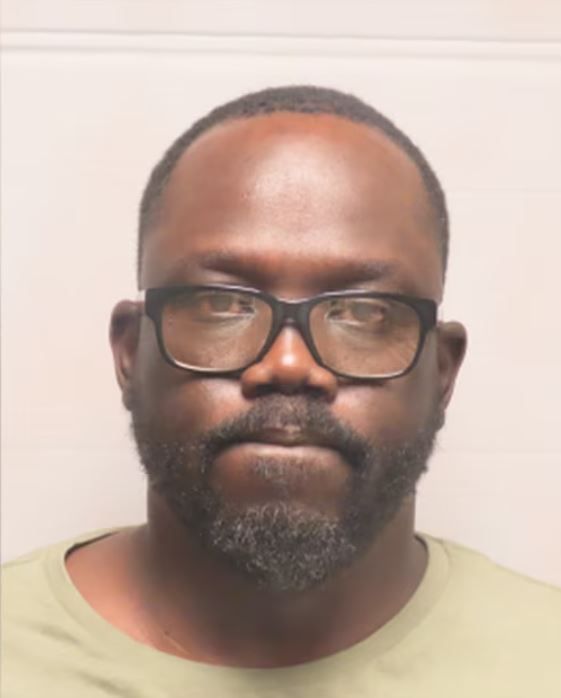 <i>Chesterfield PD/KMOV</i><br/>Diing Kacgor has been charged with stalking his wife and assaulting her with a vehicle after allegedly placing a tracking device on her car and then crashing into her with his own vehicle.