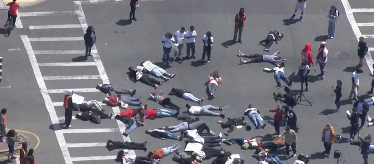 <i></i><br/>Teens hold a 'die-in' near Washington Street and Columbia Road in Boston to protest gun violence.