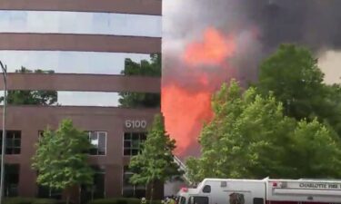 A father of four died after a fire tore through an apartment building under construction in Charlotte