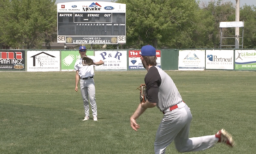 Players warm up during tryouts for Gate City Grays