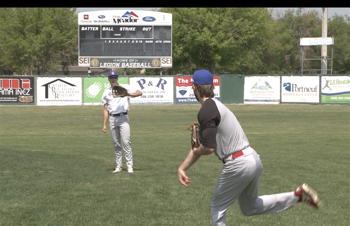 Players warm up during tryouts for Gate City Grays