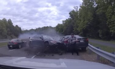 A wild video shows a Virginia police officer's extremely close call with an out-of-control car during a traffic stop Monday morning. The video