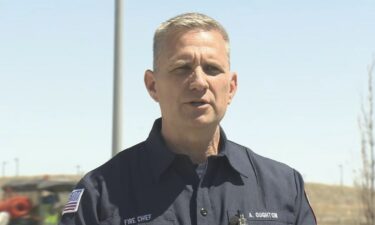 Aurora Fire Chief Alec Oughton addresses reporters at a news conference outside the Gaylord Rockies Resort after an HVAC collapse injured six people on Saturday