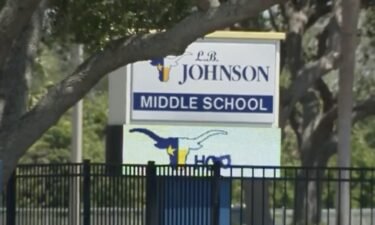 Melbourne police have charged a middle school teacher with child neglect after they say he failed to break up a fight among students on campus.