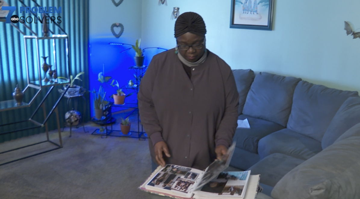 <i>WKBW</i><br/>Jackie McAdory looks at the album she made for her youngest daughter. The other album she made was lost after she shipped it to her daughter in Georgia.