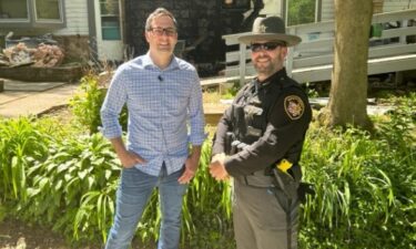 A Summit County deputy and a Coventry Township neighbor are being hailed as heroes after rescuing a 92-year-old man from a burning home.