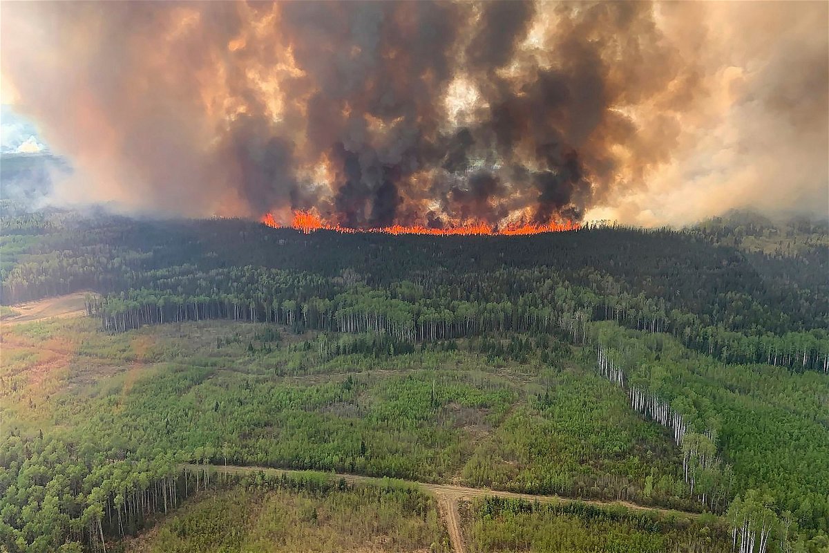 <i>Government of Alberta Fire Service/Canadian Press/AP</i><br/>The Bald Mountain Wildfire burns in the Grande Prairie Forest Area on May 12.