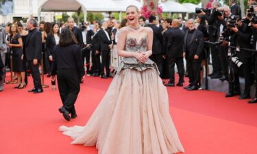 Elle Fanning attends the "Jeanne du Barry" screening & opening ceremony red carpet at the 76th annual Cannes film festival at Palais des Festivals on May 16