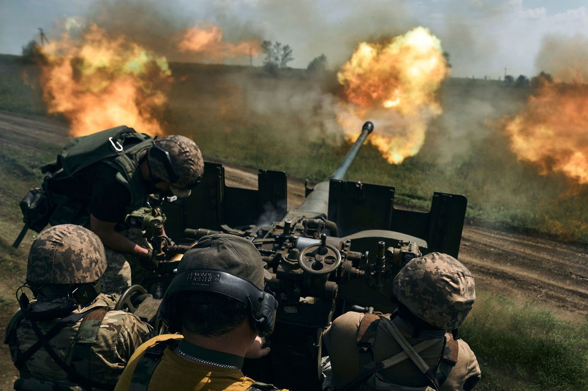 <i>LIBKOS/AP</i><br/>Ukrainian soldiers fire a cannon near Bakhmut