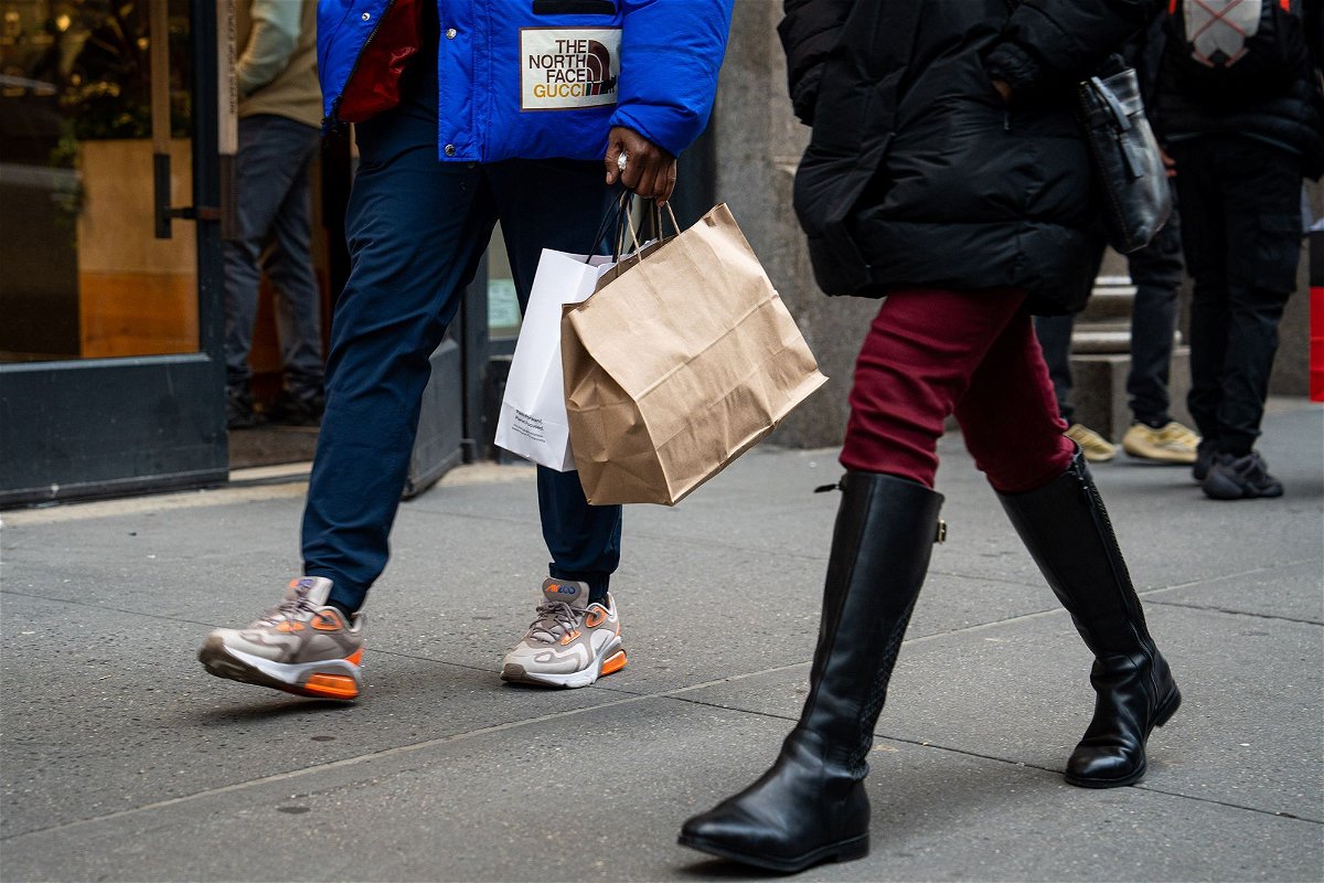 <i>Jordana Bermudez/Bloomberg/Getty Images</i><br/>The US economy grew faster in the first quarter than previously estimated. A shopper carries bags in the SoHo neighborhood of New York