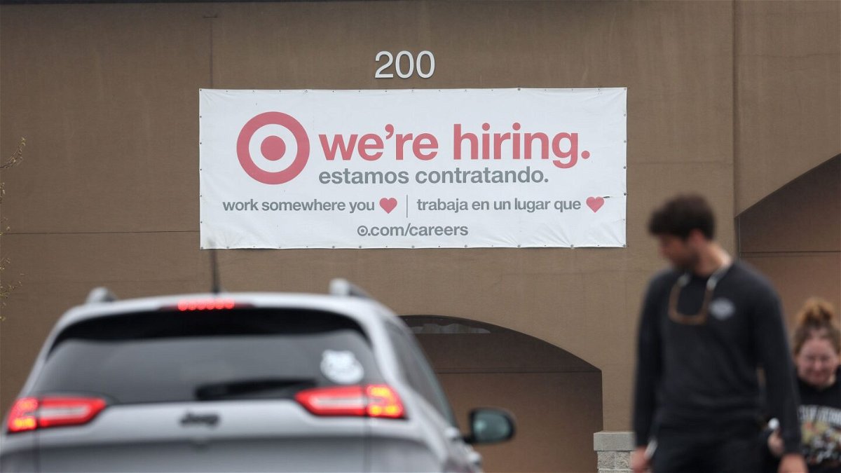 <i>Justin Sullivan/Getty Images</i><br/>People walk by a hiring sign posted on the exterior of a Target store on April 7 in Novato