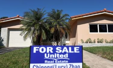 A 'For Sale' sign is posted in front of a single family home on October 27
