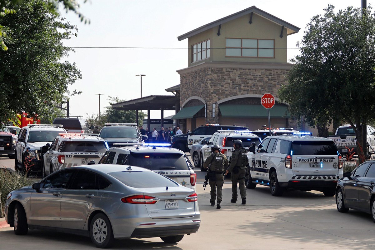<i>Stewart  F. House/Getty Images</i><br/>Emergency personnel work the scene of a shooting at Allen Premium Outlets on May 6