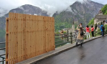A wooden fence was temporarily put up in the Austrian village of Hallstatt to deter would-be selfie takers.