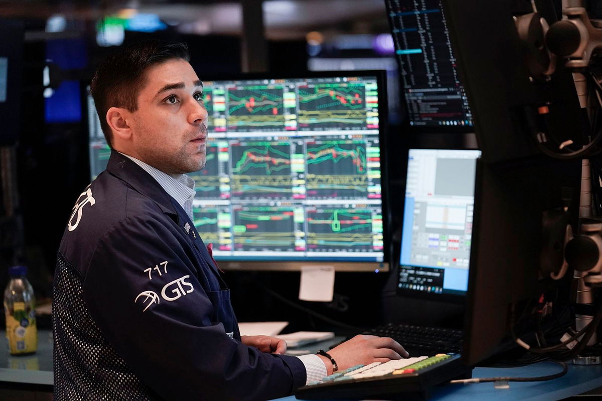 <i>Seth Wenig/AP</i><br/>Traders work on the floor at the New York Stock Exchange in New York