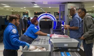 Transportation Security Administration officers use new Computed Tomography (CT) scanners on bags at Miami International Airport in May. The TSA has announced an expansion of TSA PreCheck access.