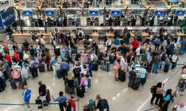Travelers make their way through Hartsfield-Jackson Atlanta International Airport on Thursday