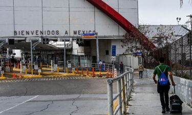 People cross the border at the Gateway International Bridge into Matamoros