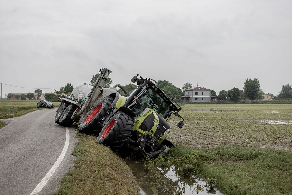 <i>Andrea Carrubba/Anadolu Agency/Getty Images</i><br/>A tractor goes off road after flooding outside Ravenna in the Emilia Romagna region of Italy on May 20.