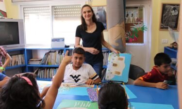 Amahl Bishara helps Palestinian children at Aida Refugee Camp create an alphabet book about their childhood.