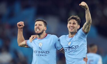 Rúben Dias and John Stones celebrate beating Real Madrid on Wednesday.