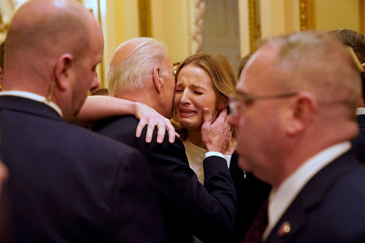 <i>Jacquelyn Martin/Pool/AFP/Getty Images</i><br/>President Joe Biden hugs Brittany Alkonis