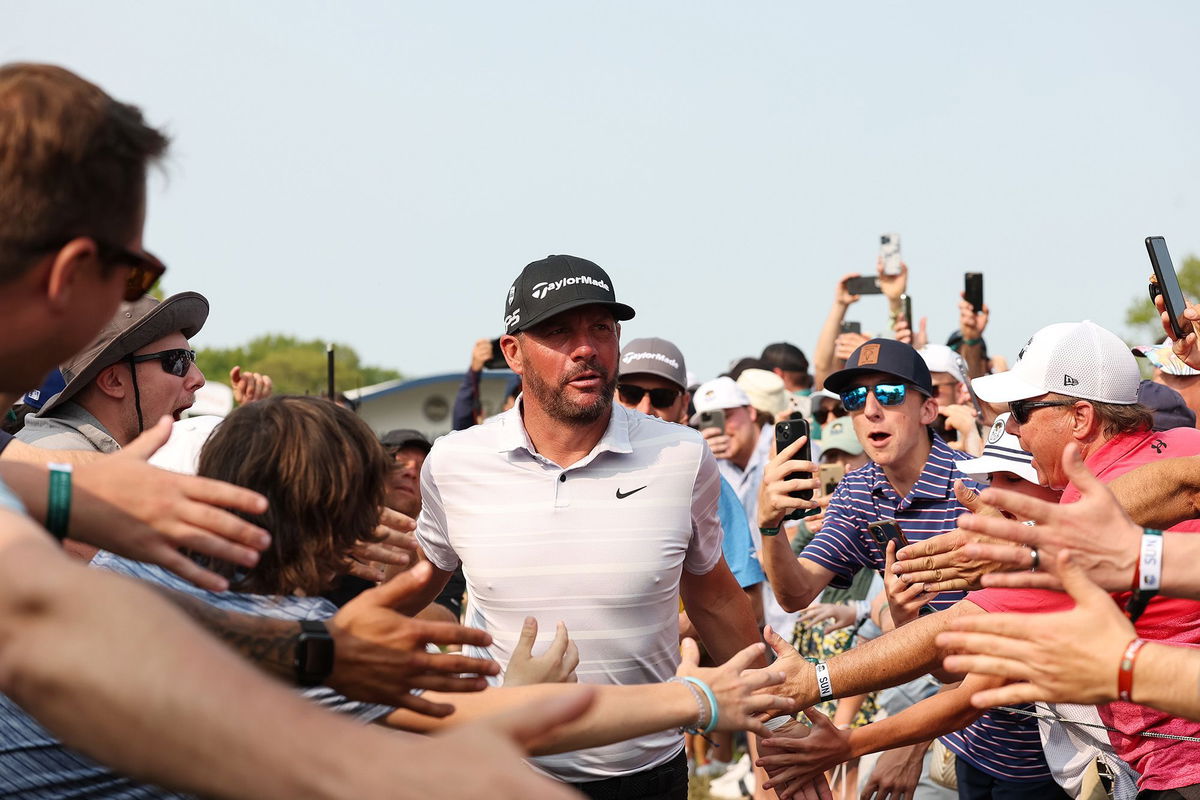 <i>Scott Taetsch/PGA of America/Getty Images</i><br/>Block celebrates with spectators after hitting a hole-in-one on the 15th hole.